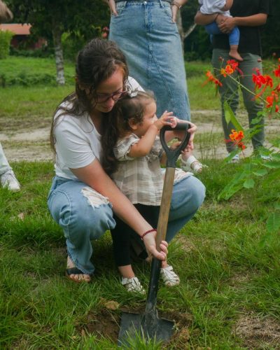 Bethany planting a tree in remembrance of baby Wyatt.